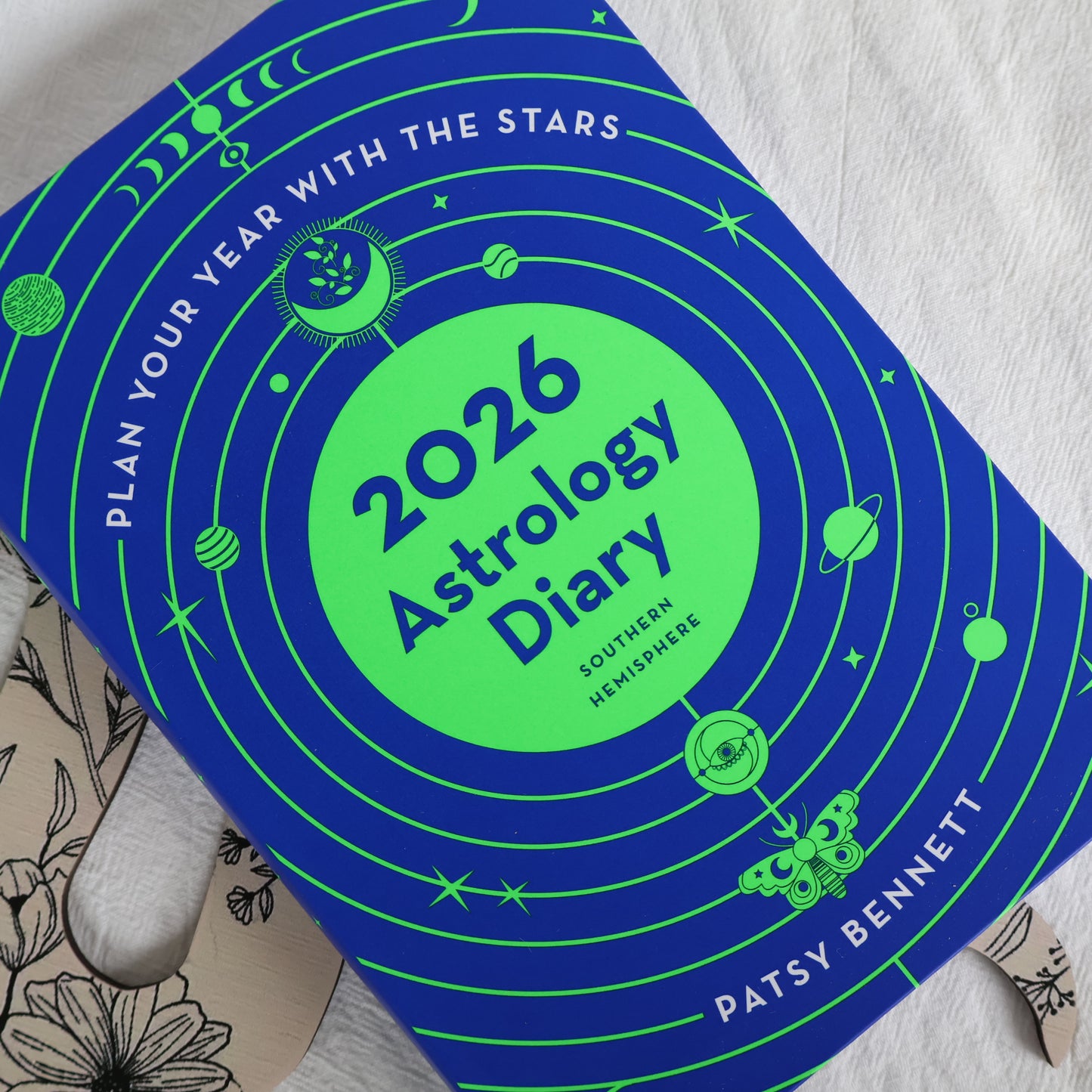 2026 Astrology Diary with blue and green design on a light gray background