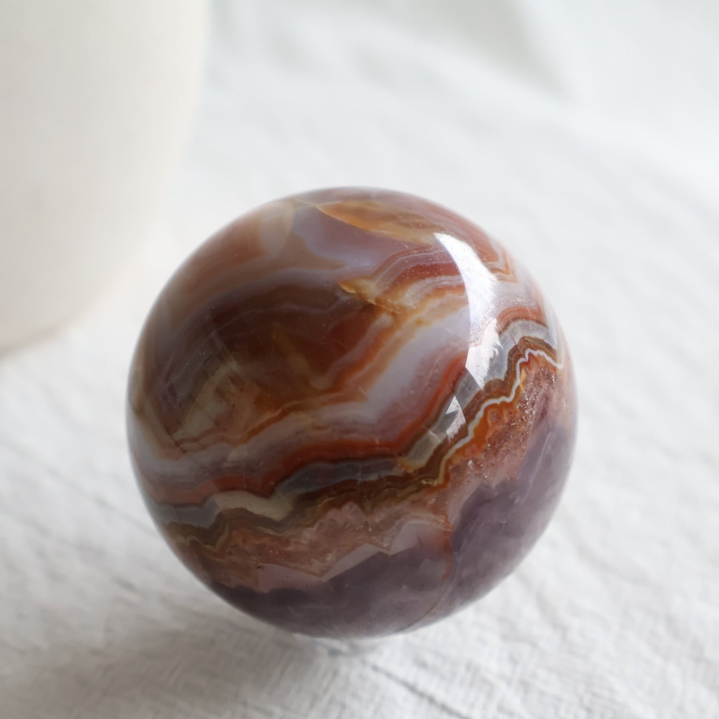 Amethyst Agate sphere with purple Amethyst crystal, sparkling druzy and intricate brown, cream and grey Agate banding.