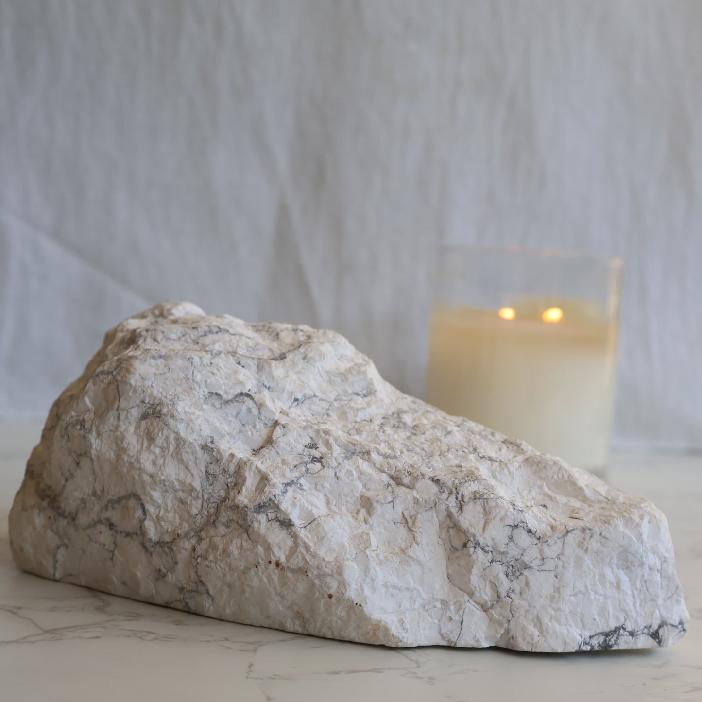 howlite freeform with polished face and natural raw side showing grey veining patterns