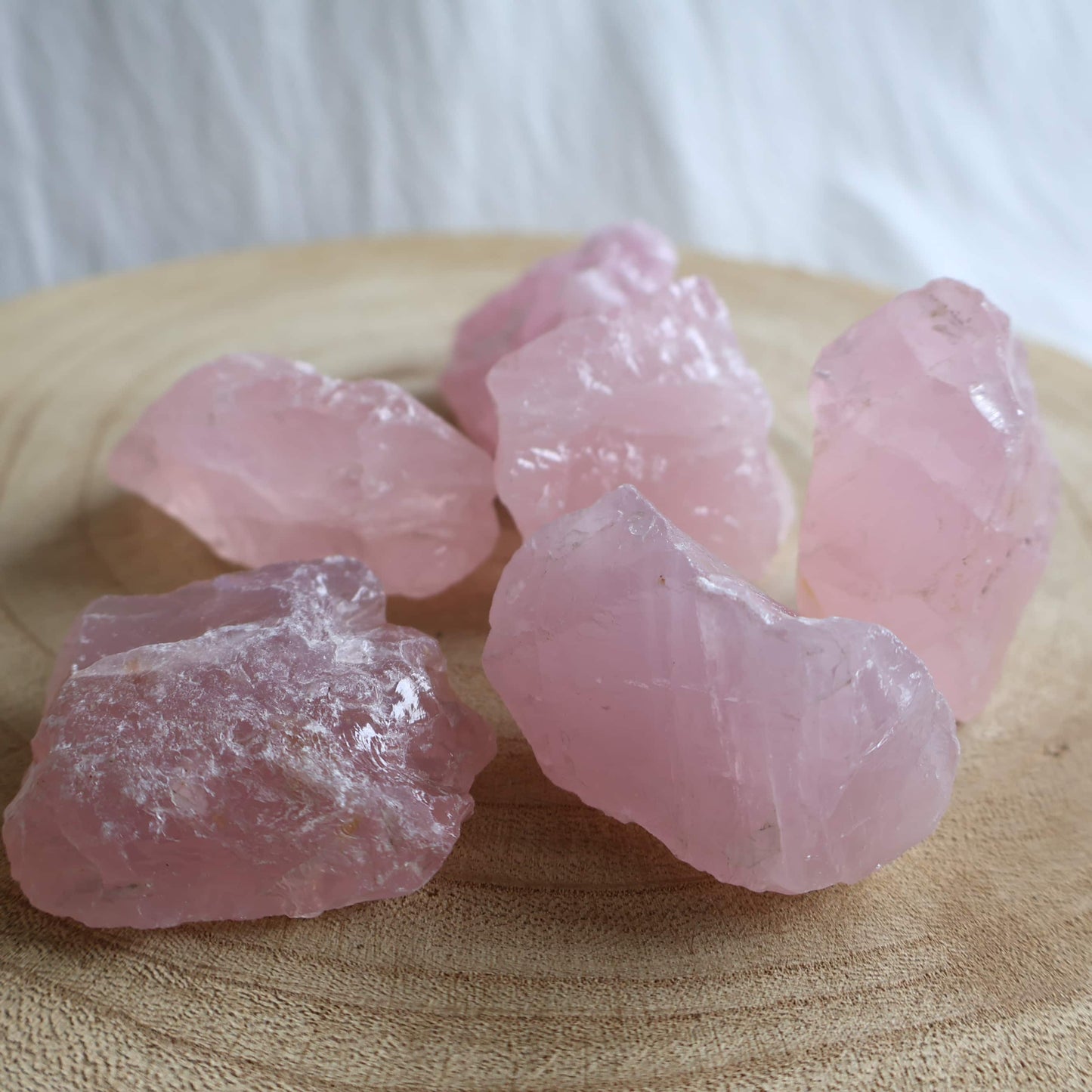 Natural Rose Quartz rough pieces in soft blush pink tones with raw, unpolished texture. Intuitively chosen.