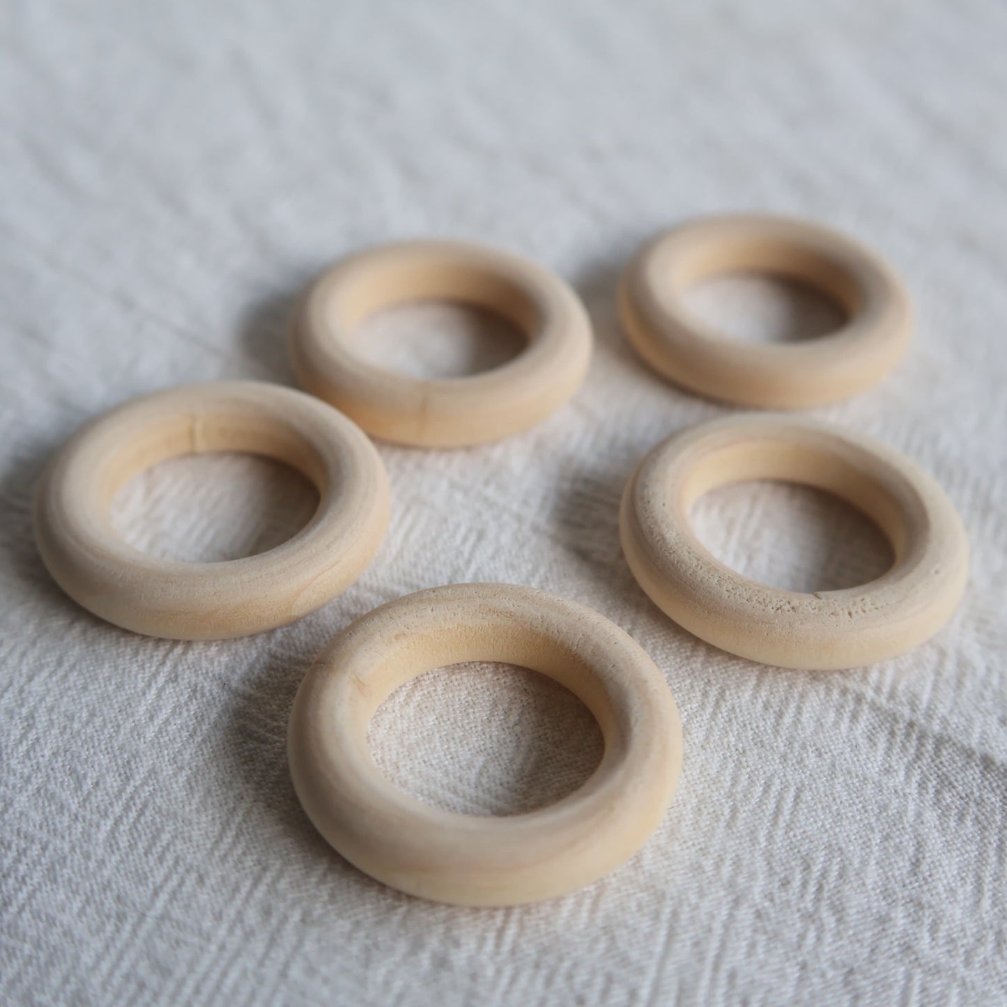 Natural wooden sphere stand ring with smooth rounded finish designed to display small and medium crystal spheres.