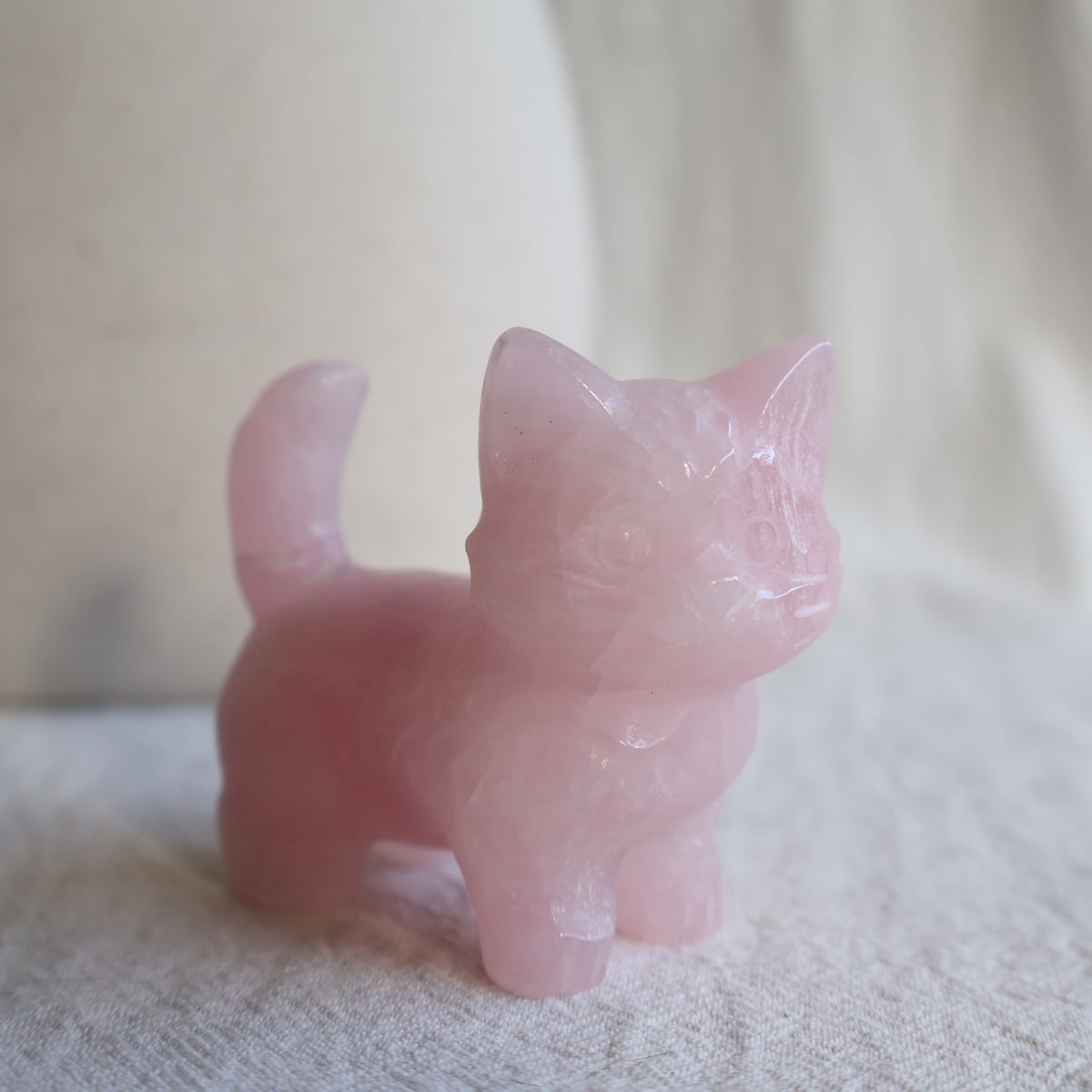 Medium standing cat crystal carvings in Rose Quartz, Fire Quartz, Blue Aventurine and Larvikite, approximately 5cm tall.