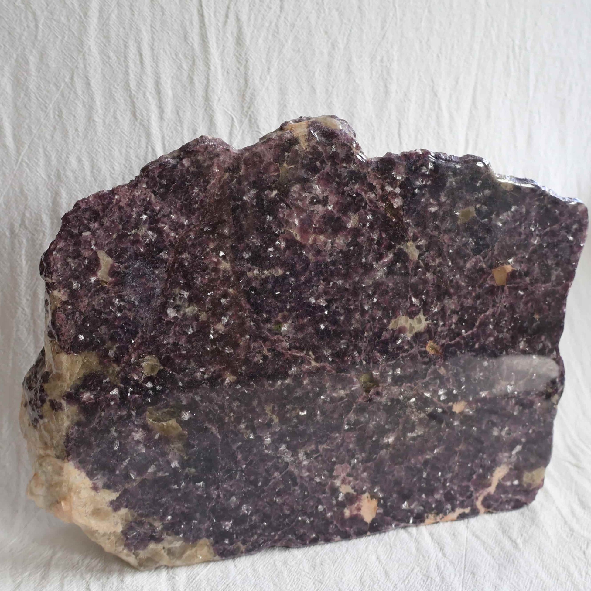 XXXL Lepidolite freestanding slab with deep plum and mauve colouring, sparkling mica detail and polished acrylic-coated face, weighing 5.09kg