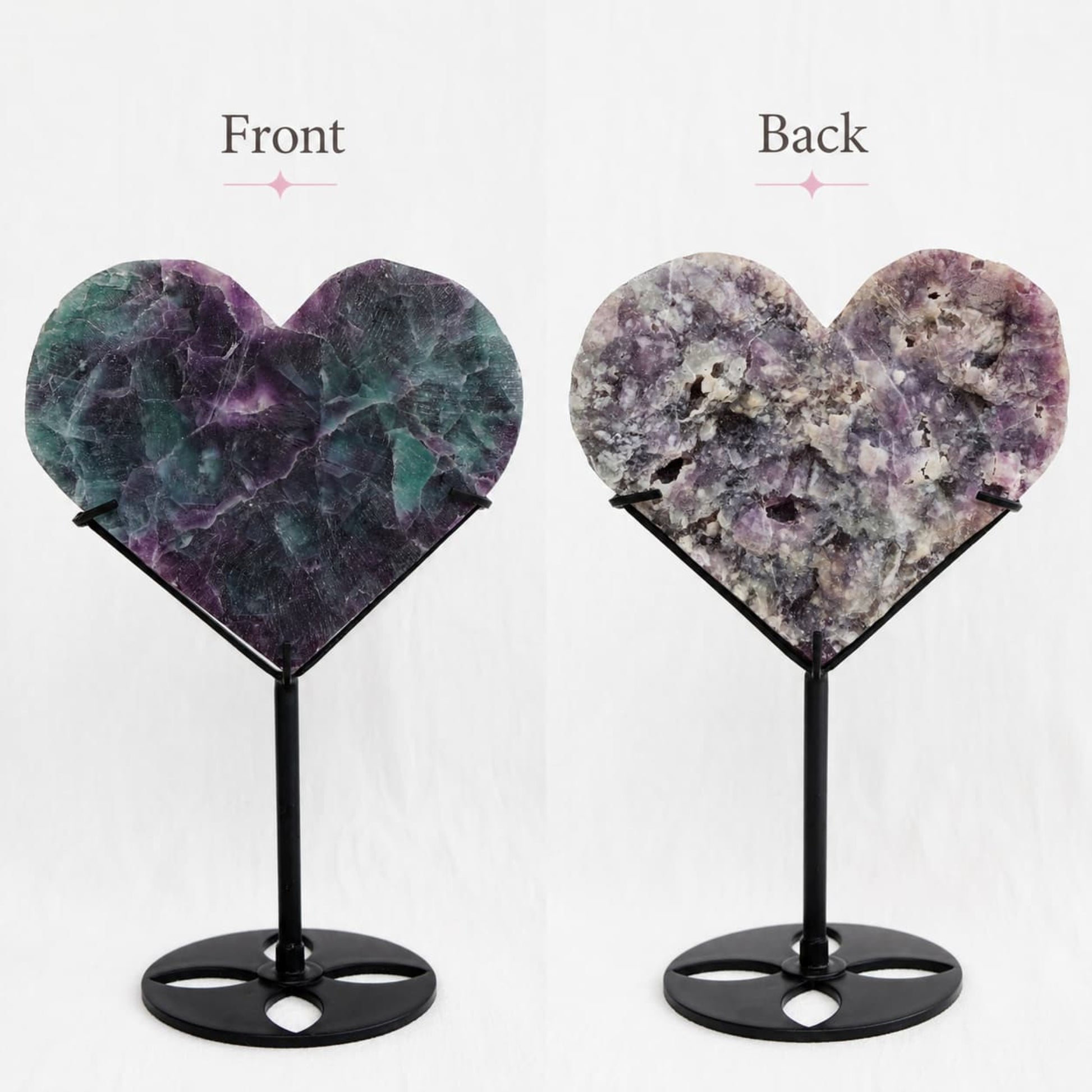 Large teal-green and purple Fluorite heart on black stand with a roughly polished face and contrasting raw lavender crystal reverse, 23cm tall.