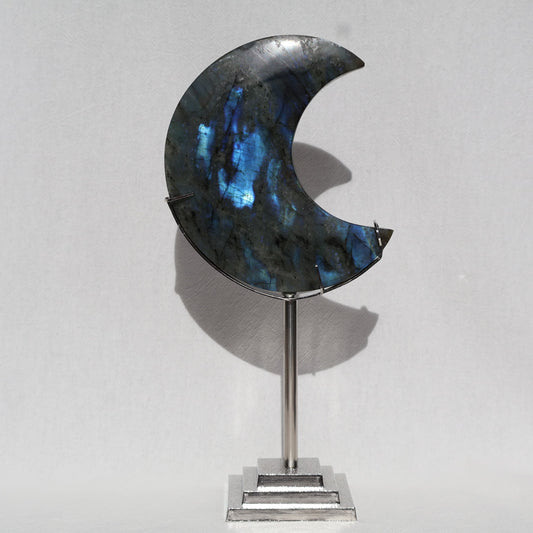 Labradorite moon carving on silver stand, stunning blue flash
