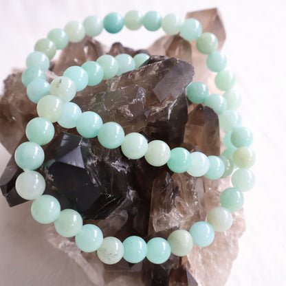Natural Amazonite 6mm crystal bead bracelet in soft aqua, mint and seafoam green tones on a stretch cord.