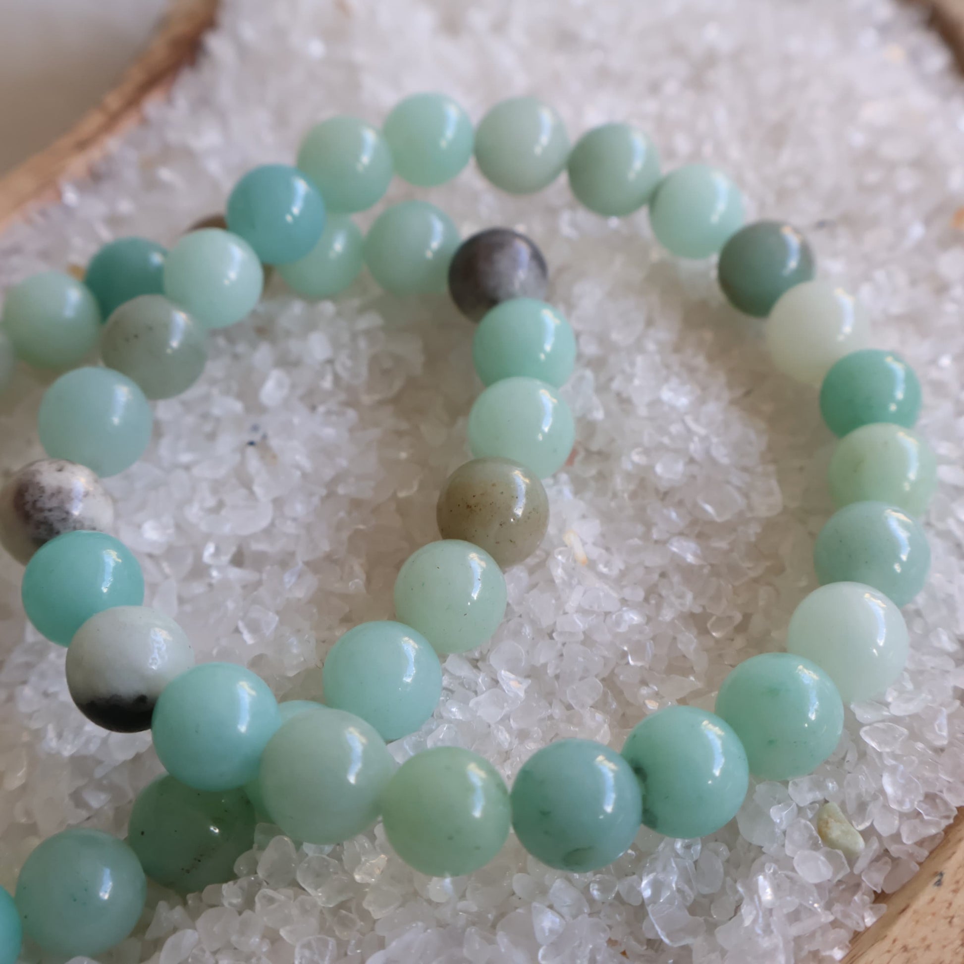 Natural Amazonite 6mm crystal bead bracelet in soft aqua, mint and seafoam green tones on a stretch cord.