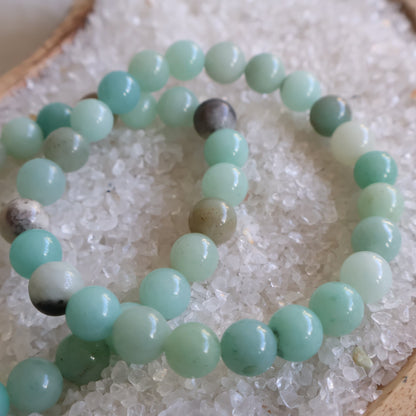 Natural Amazonite 6mm crystal bead bracelet in soft aqua, mint and seafoam green tones on a stretch cord.
