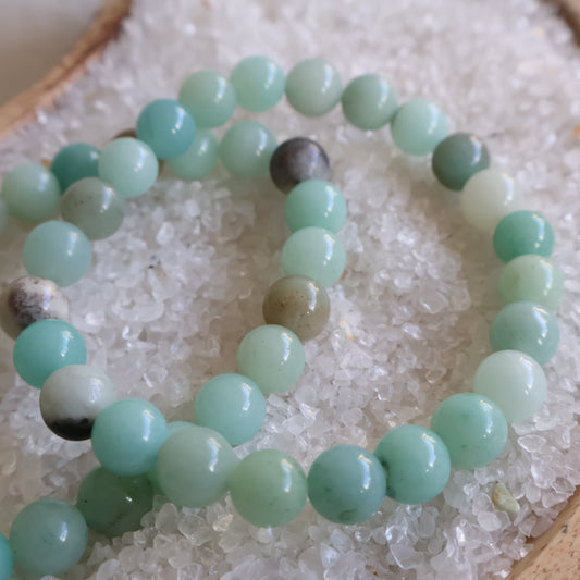 Natural Amazonite 6mm crystal bead bracelet in soft aqua, mint and seafoam green tones on a stretch cord.