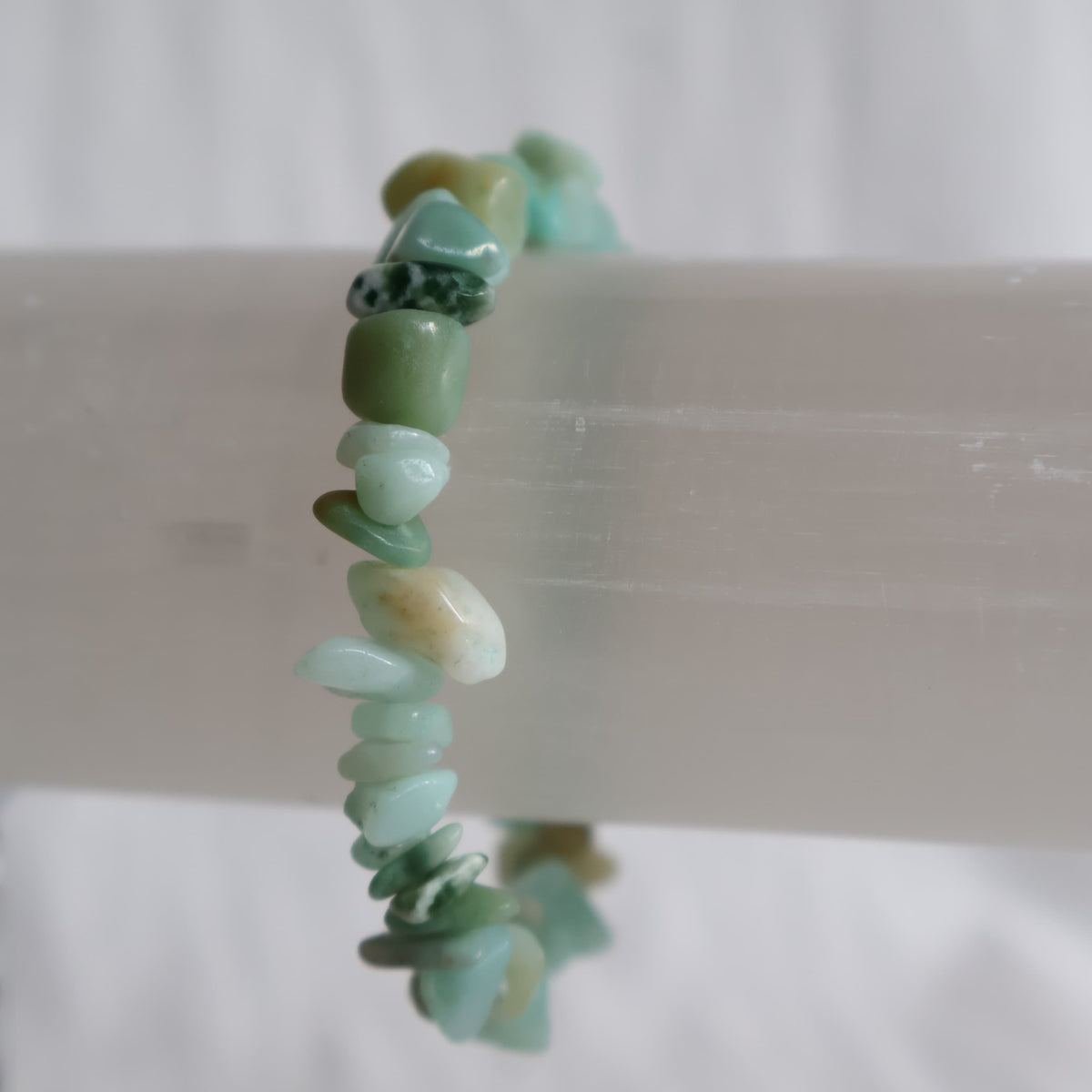 Natural Amazonite chip crystal bracelet with blue-green and turquoise stone chips on a stretch band.