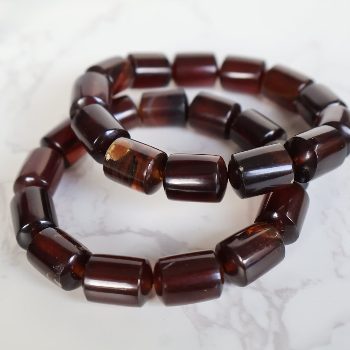 Natural Amber 12mm bead stretch bracelet with warm golden and honey tones and unique organic inclusions.