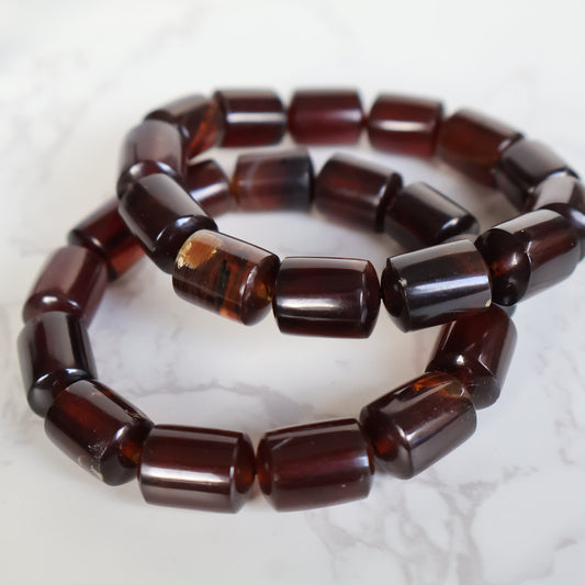 Natural Amber 12mm bead stretch bracelet with warm golden and honey tones and unique organic inclusions.