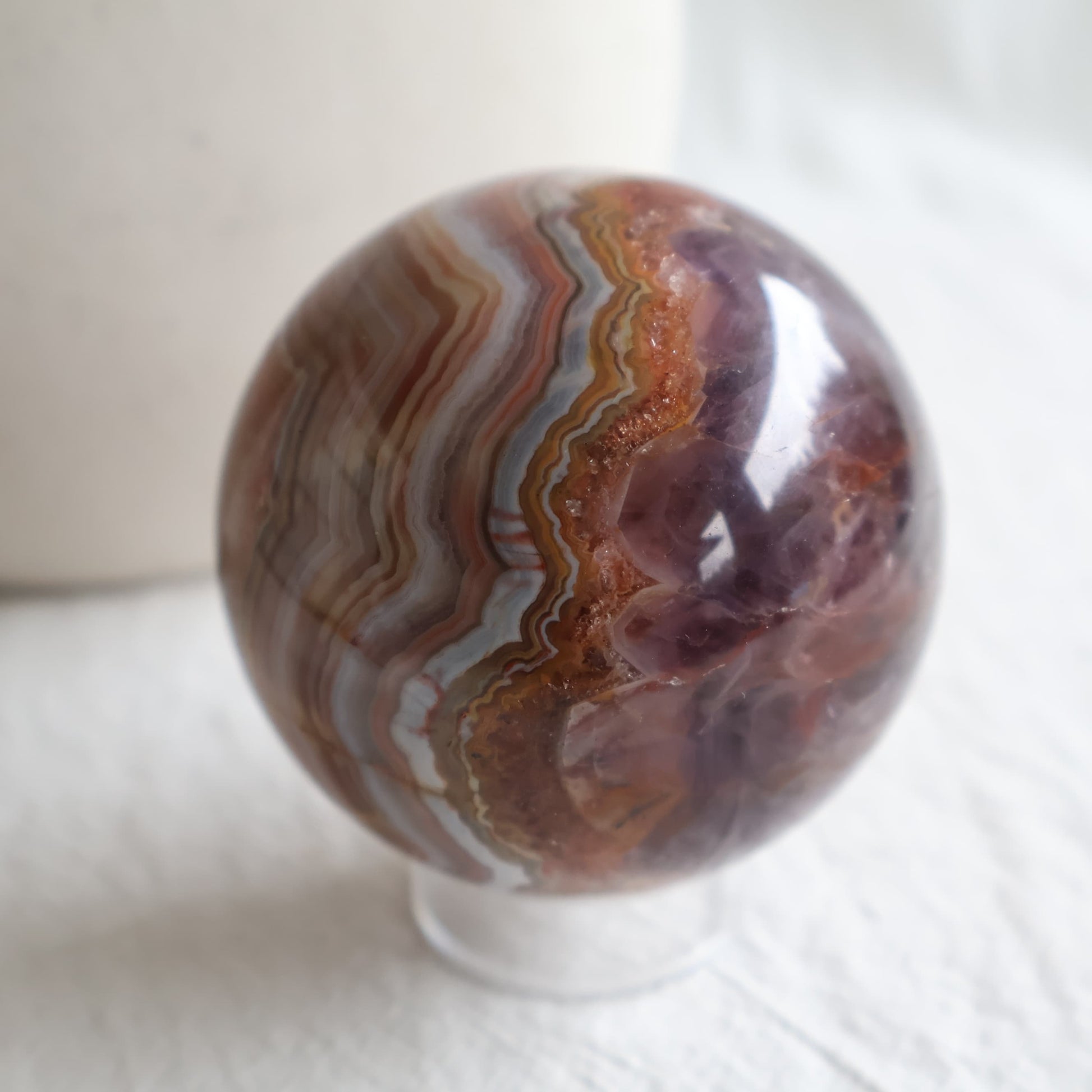 Amethyst Agate sphere with purple Amethyst crystal, sparkling druzy and intricate brown, cream and grey Agate banding.
