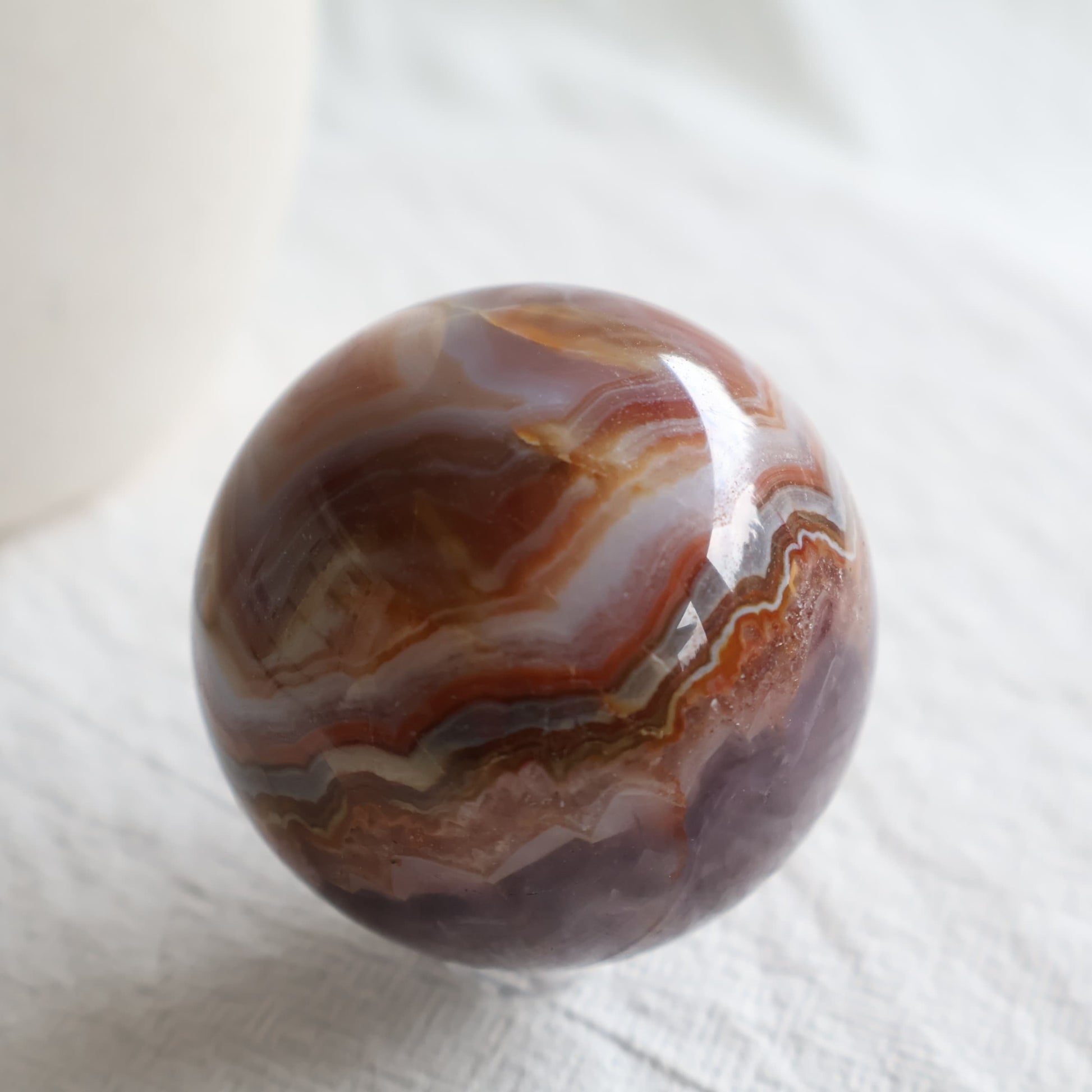 Amethyst Agate sphere with purple Amethyst crystal, sparkling druzy and intricate brown, cream and grey Agate banding.