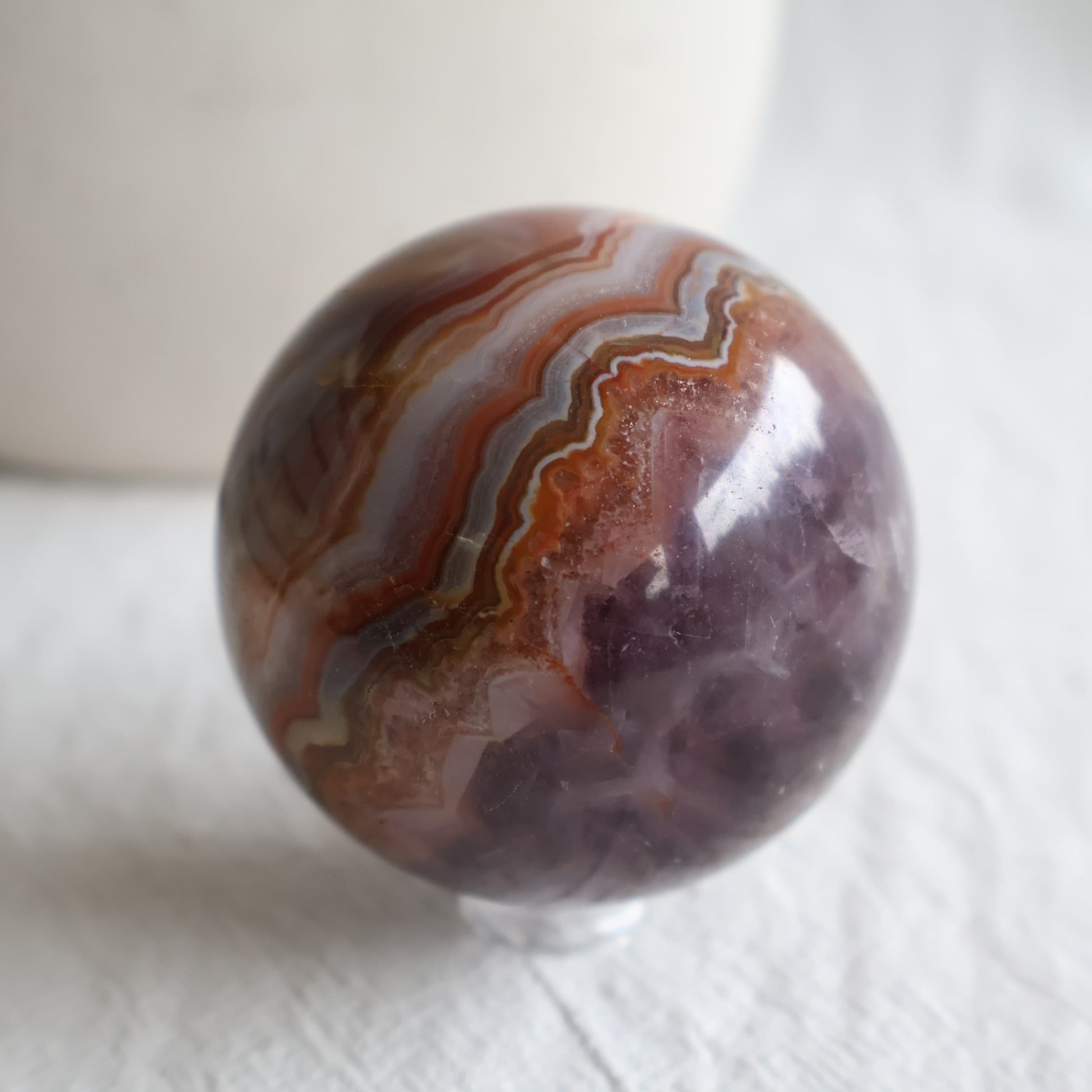 Amethyst Agate sphere with purple Amethyst crystal, sparkling druzy and intricate brown, cream and grey Agate banding.