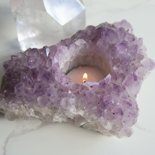 Amethyst cluster candle holder with purple crystal points and space for tealight candle