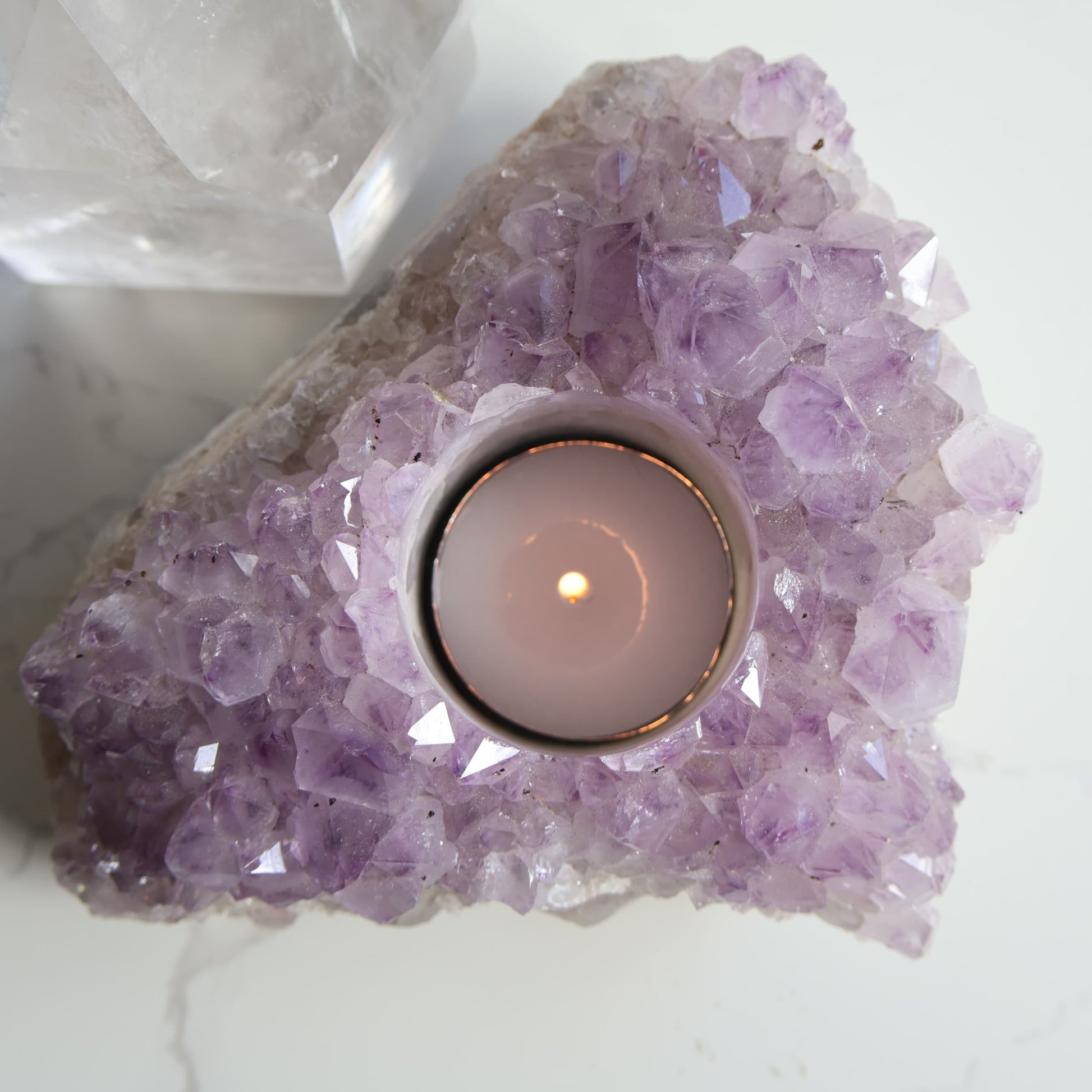 Amethyst cluster candle holder with purple crystal points and space for tealight candle