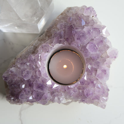Amethyst cluster candle holder with purple crystal points and space for tealight candle