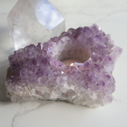 Amethyst cluster candle holder with purple crystal points and space for tealight candle