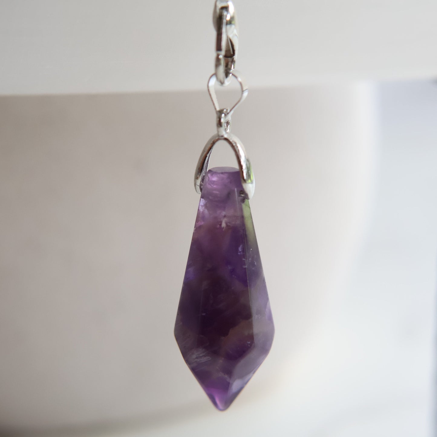 Crystal pendulum intuitively chosen from Labradorite, Rose Quartz, or Amethyst. A simple tool for intuition, reflection, and energy work