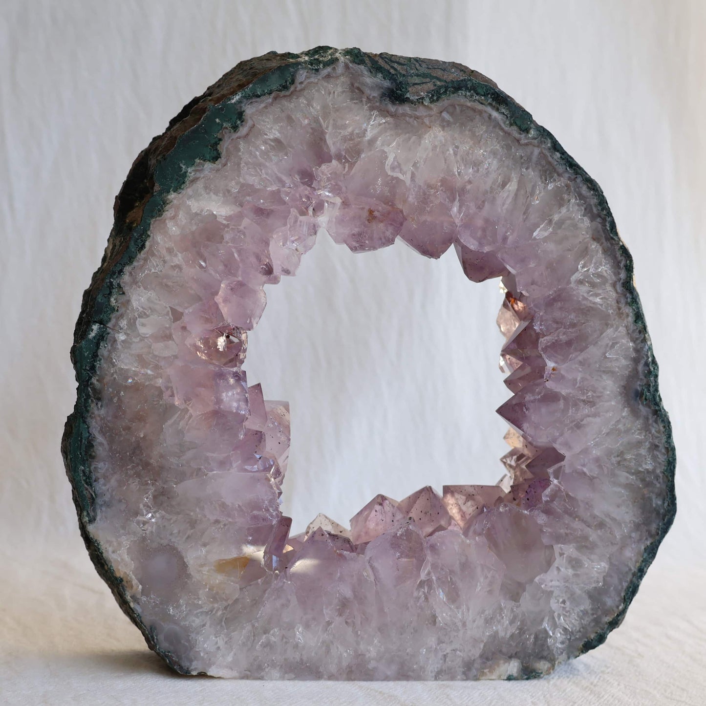 amethyst portal geode with pale purple crystal points and natural hollow centre