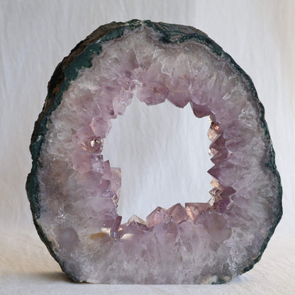 amethyst portal geode with pale purple crystal points and natural hollow centre