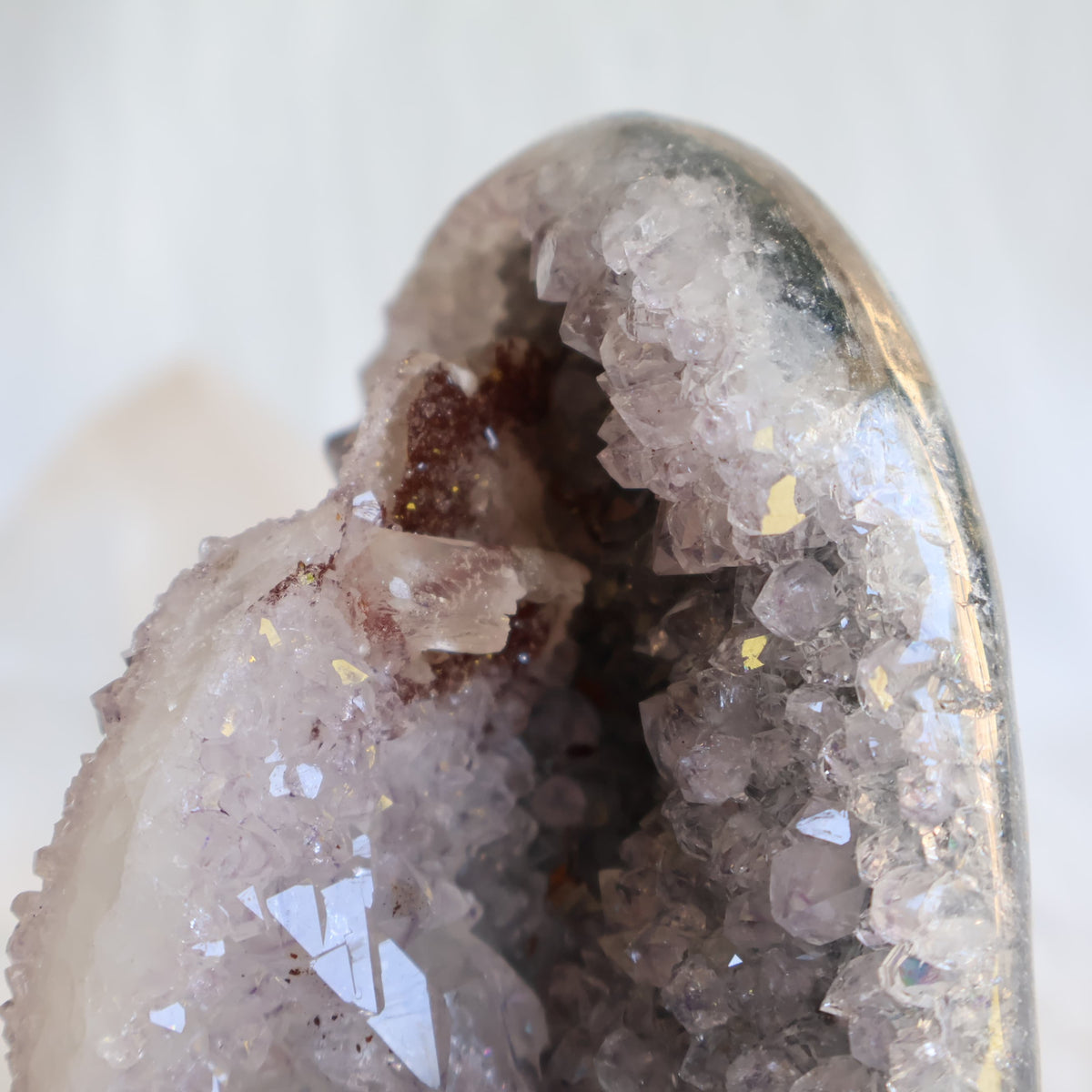 Amethyst cut base with natural Quartz crystal growth and Hematite inclusions, 12cm tall and weighing 807g.