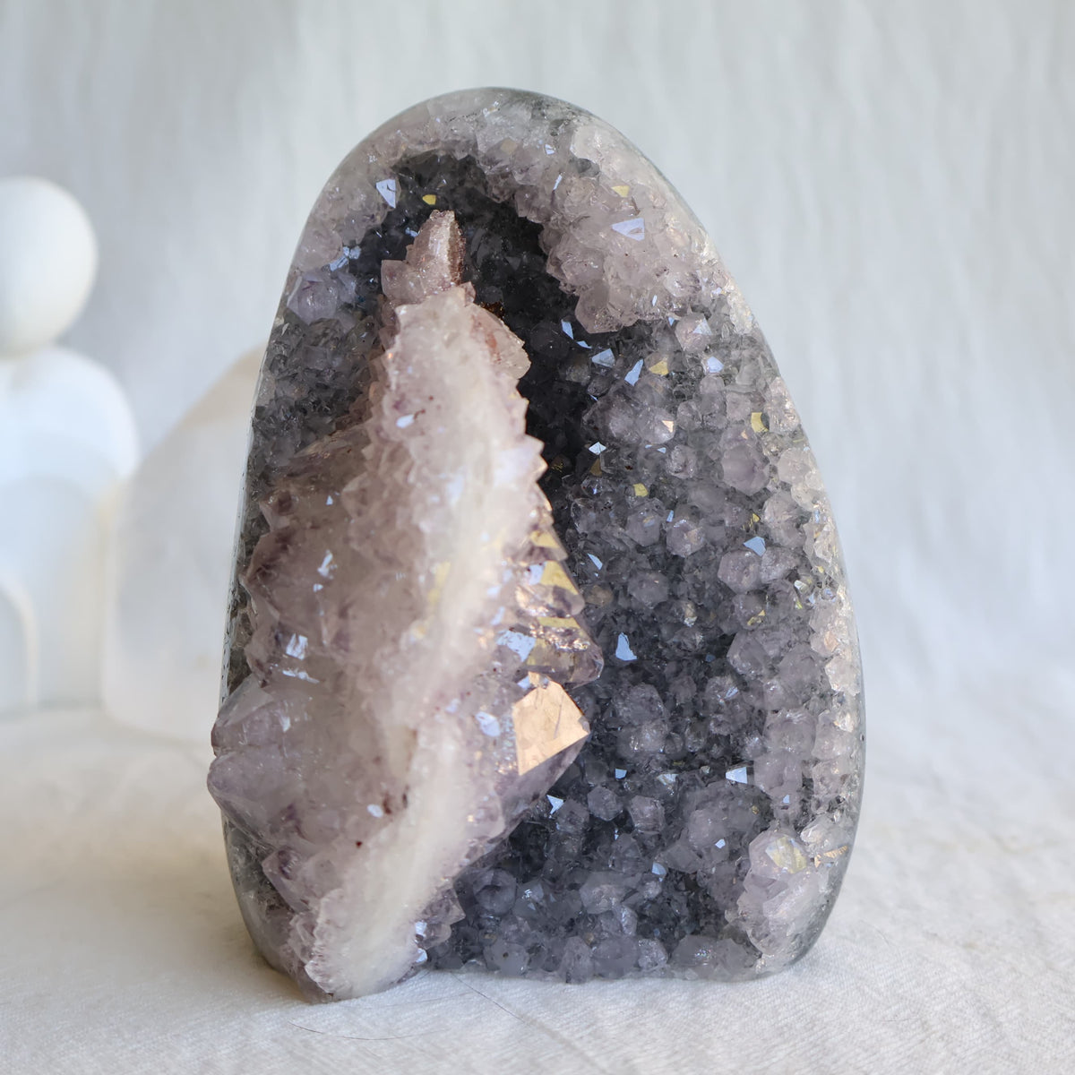 Amethyst cut base with natural Quartz crystal growth and Hematite inclusions, 12cm tall and weighing 807g.