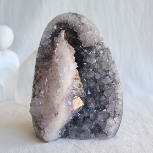 Amethyst cut base with natural Quartz crystal growth and Hematite inclusions, 12cm tall and weighing 807g.
