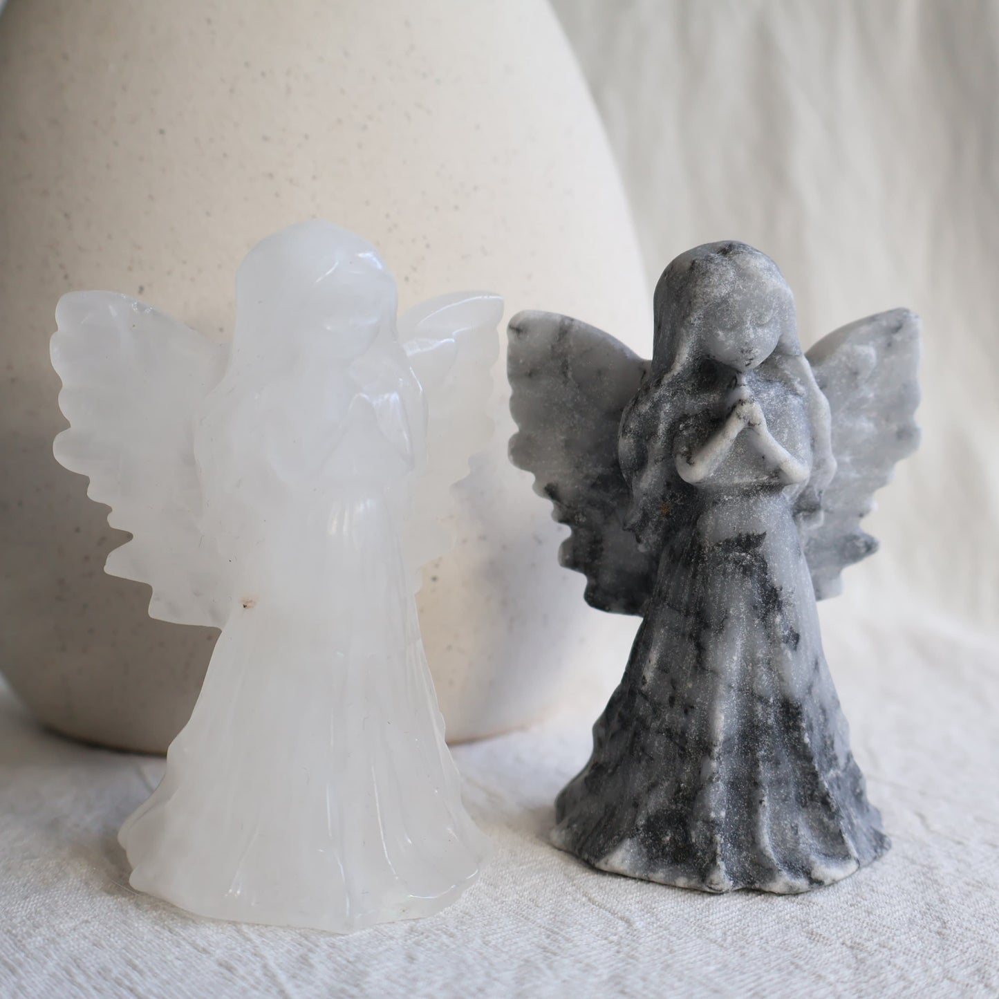 angel carving with detailed wings, clasped hands and flowing gown, 8.5cm tall