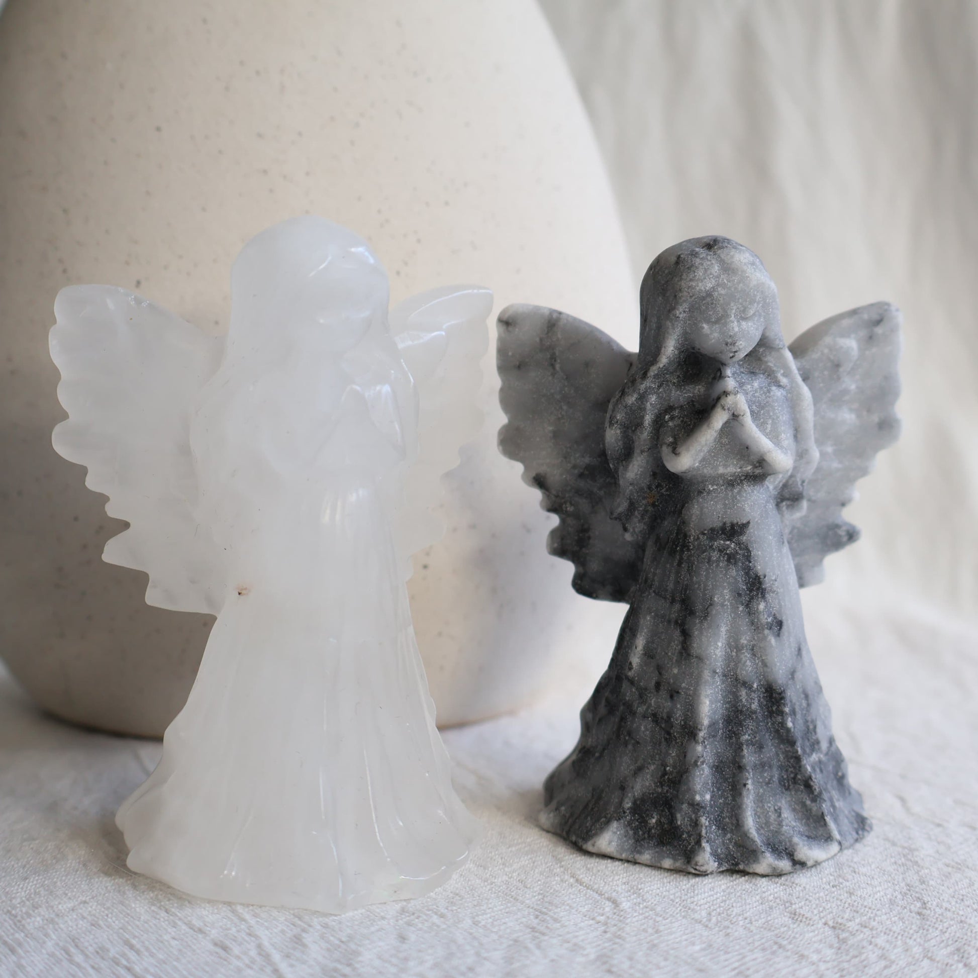 angel carving with detailed wings, clasped hands and flowing gown, 8.5cm tall