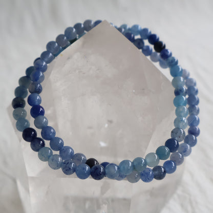 Natural Blue Aventurine 4mm crystal bead bracelet in soft denim blue tones with subtle natural shimmer on a stretch cord.