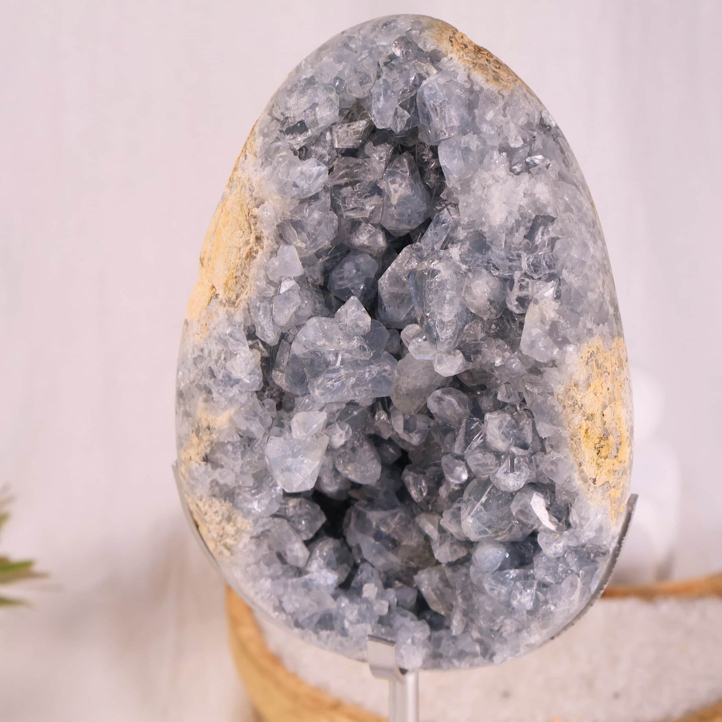 large blue celestite cluster on stand