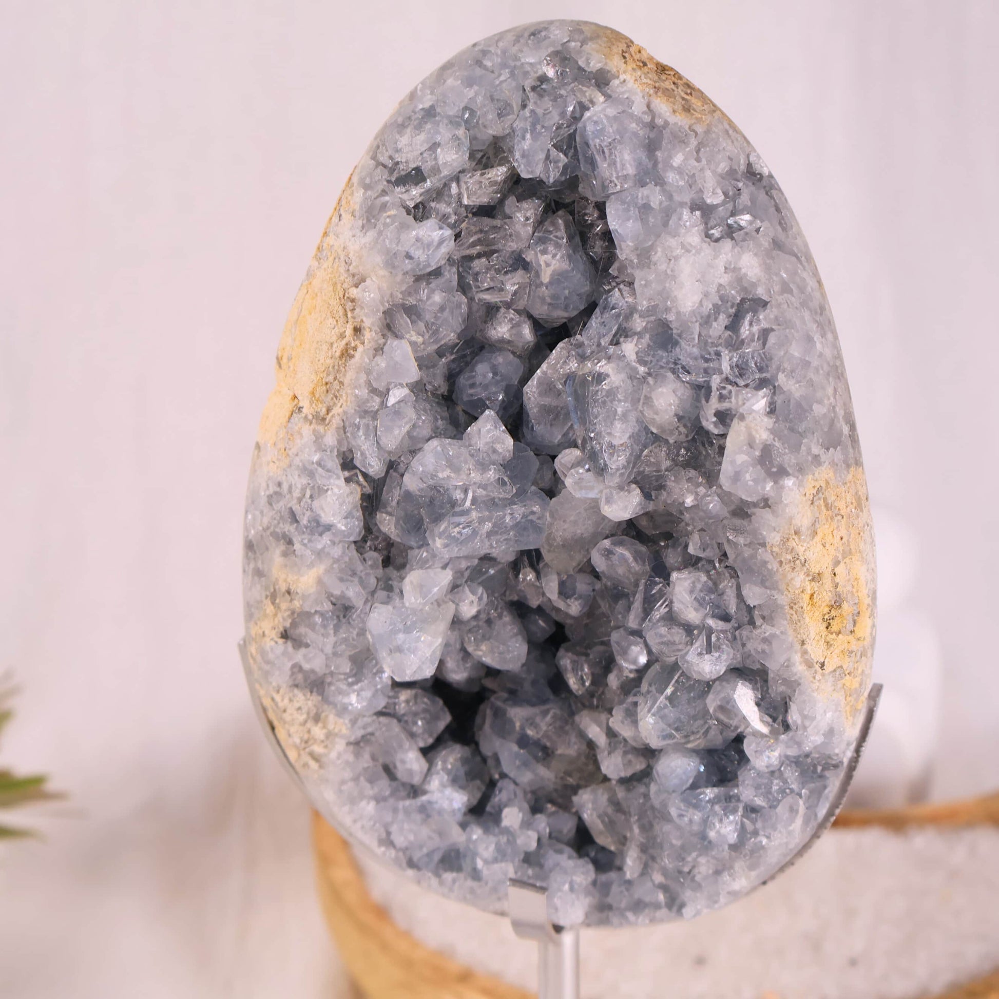 large blue celestite cluster on stand