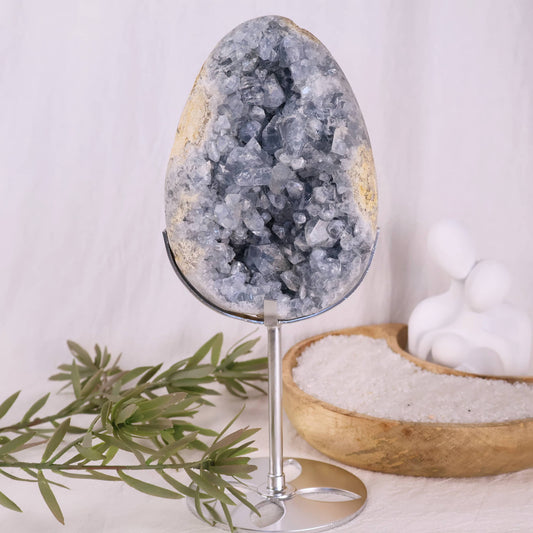 large blue celestite cluster on stand