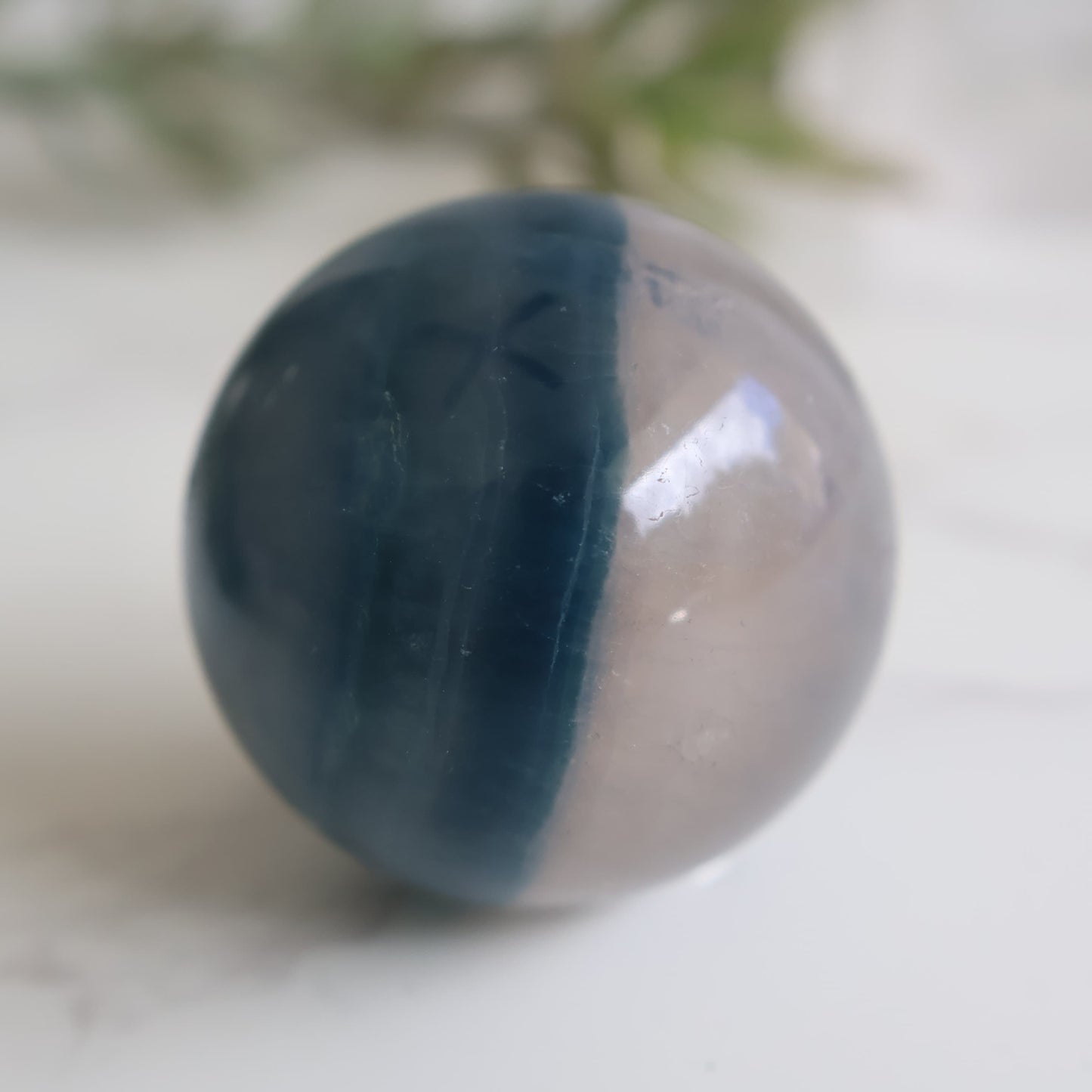 blue fluorite crystal sphere with soft blue tones and natural banding polished sphere
