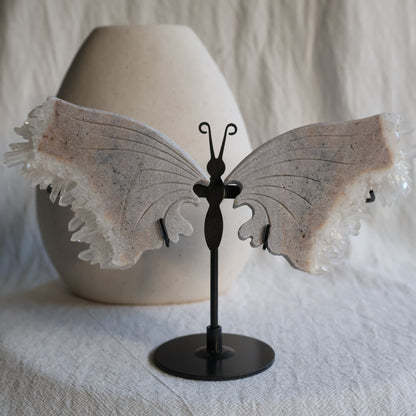 clear quartz butterfly with natural clusters on stand
