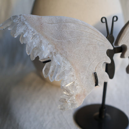 clear quartz butterfly with natural clusters on stand