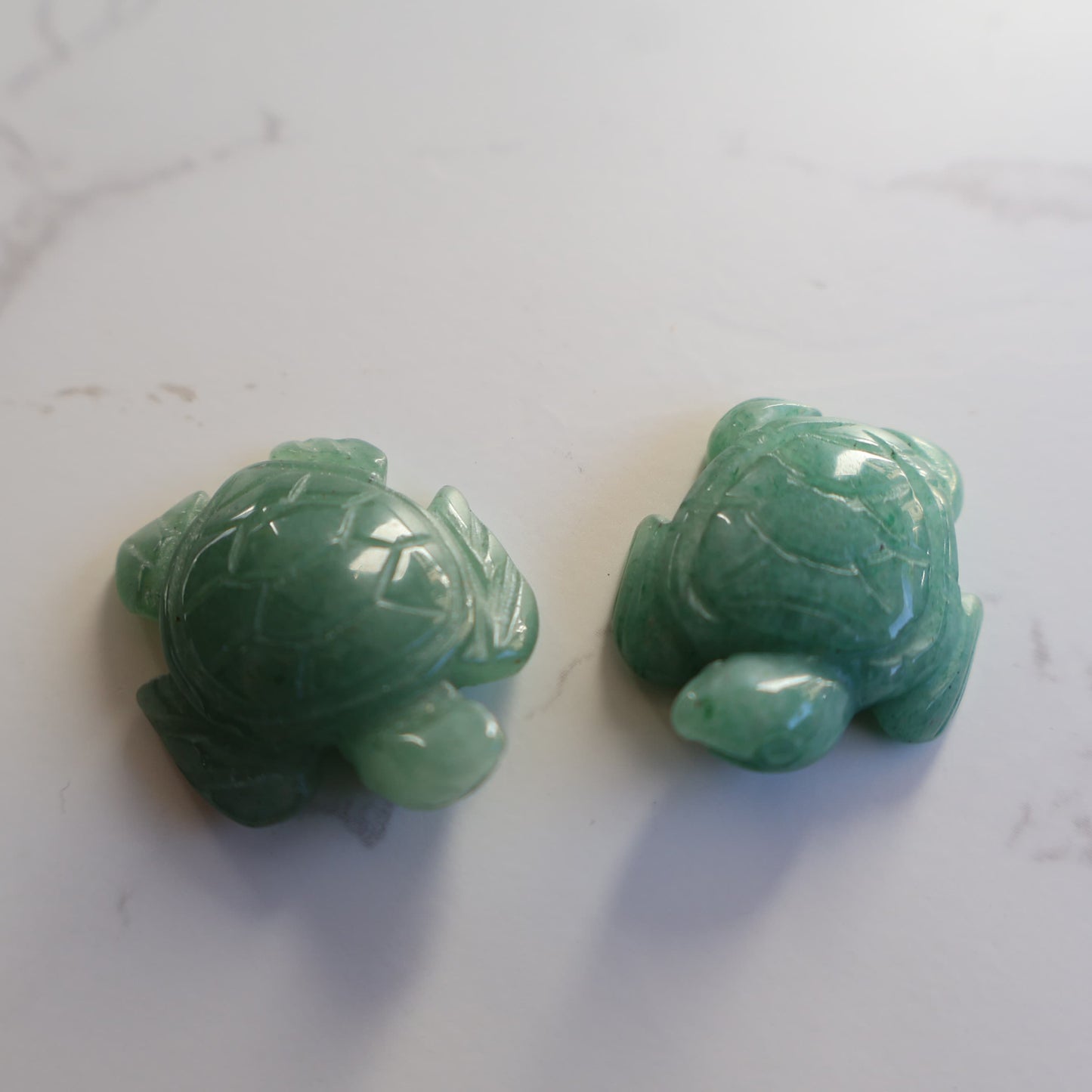 Mini crystal turtle carvings in Dream Amethyst, Green Aventurine and Tiger's Eye with polished finish and detailed shell carving.