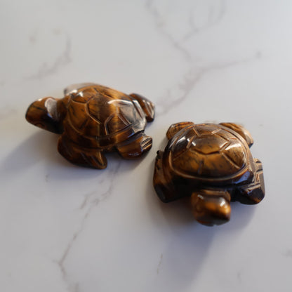 Mini crystal turtle carvings in Dream Amethyst, Green Aventurine and Tiger's Eye with polished finish and detailed shell carving.