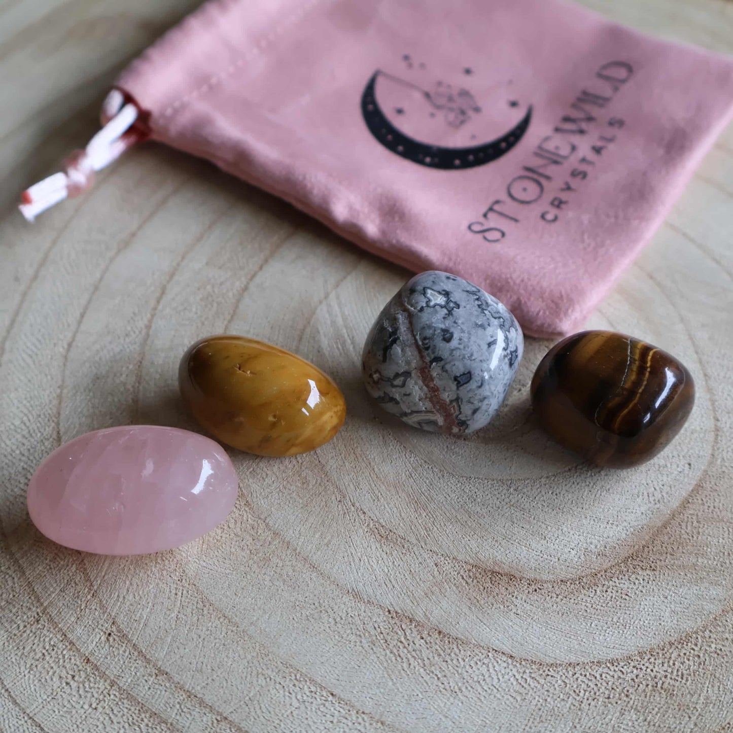 Everyday balance crystal tumble set with picasso jasper mookaite rose quartz and tigers eye in a Stonewild drawstring bag
