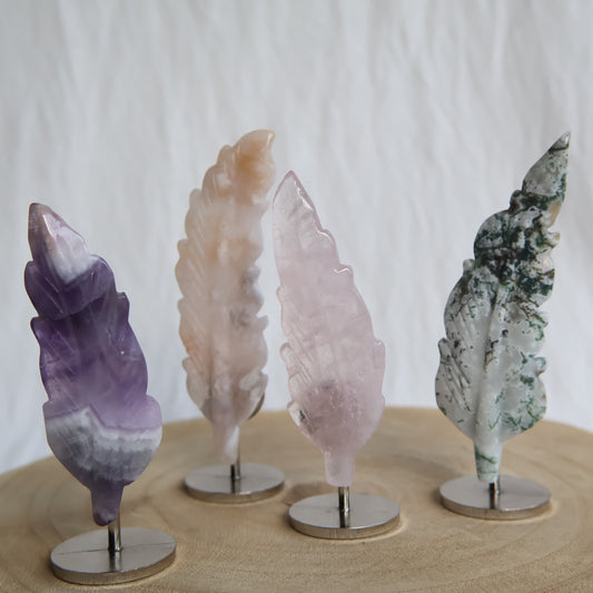 crystal feather carvings on stand in rose quartz moss agate amethyst and flower agate