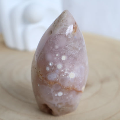 Flower Agate freeform with soft muted tones and natural floral-like plume patterns, polished into a smooth 7.5cm display piece.