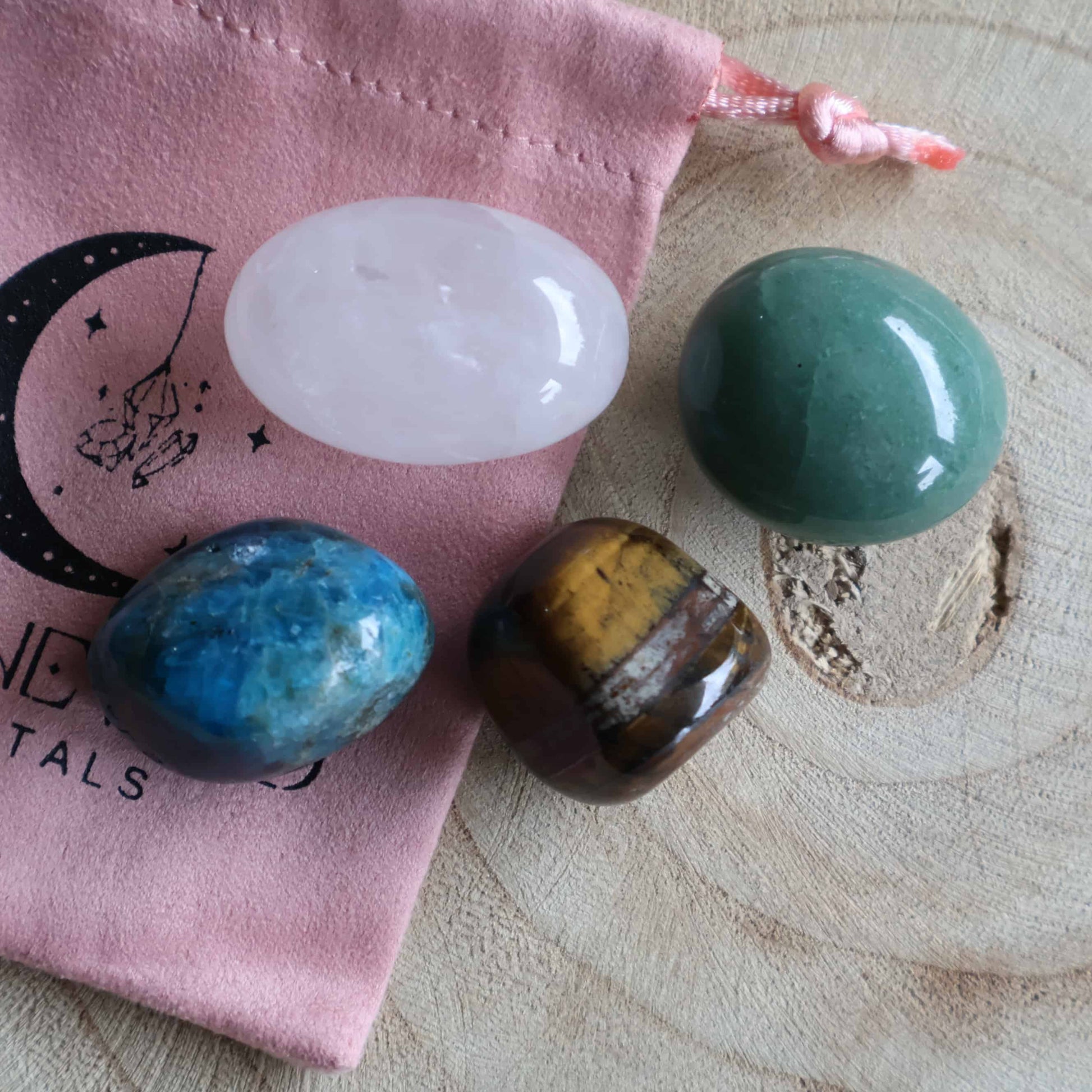 A focus and motivation crystal tumble set designed to support confidence, clarity, and forward movement. Includes four natural stones, a Stonewild drawstring bag, and a crystal guide card.
