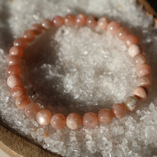 Golden Sunstone 6mm bead stretch bracelet with warm golden tones and a subtle natural reflective shimmer.