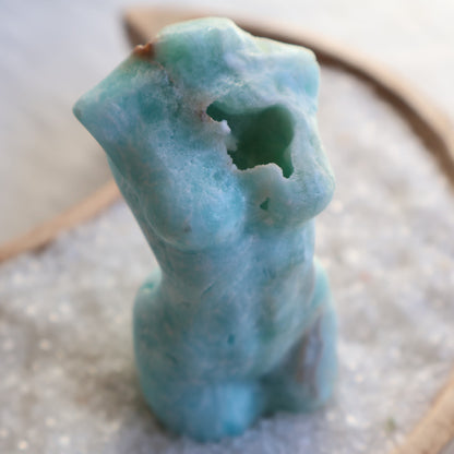 Hemimorphite Goddess carving with soft blue-green colouring, natural druzy cavities, polished feminine silhouette, and organic mineral patterns,