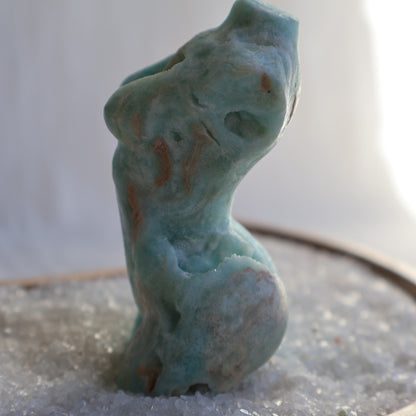 Hemimorphite Goddess carving with soft blue-green colouring, natural druzy cavities, polished feminine silhouette, and organic mineral patterns,