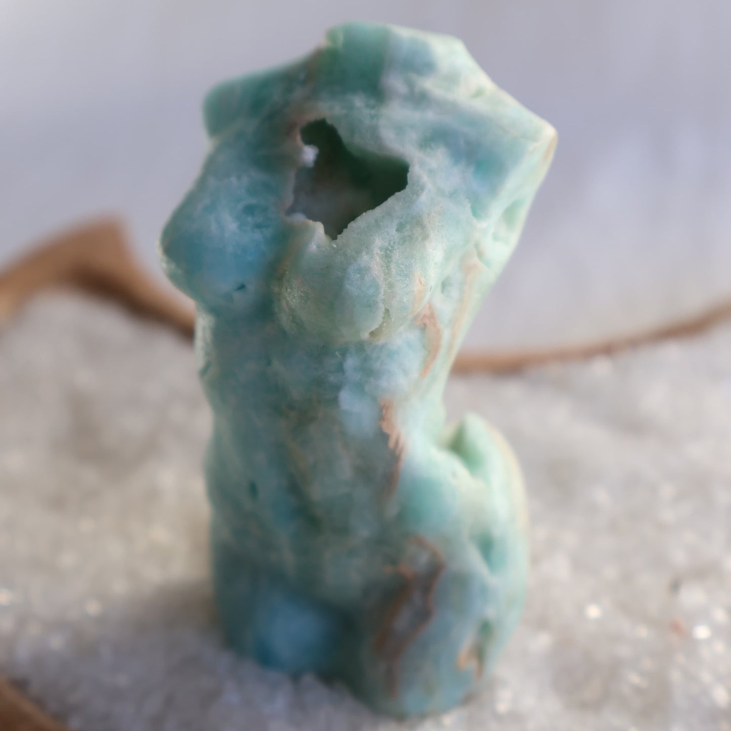 Hemimorphite Goddess carving with soft blue-green colouring, natural druzy cavities, polished feminine silhouette, and organic mineral patterns,