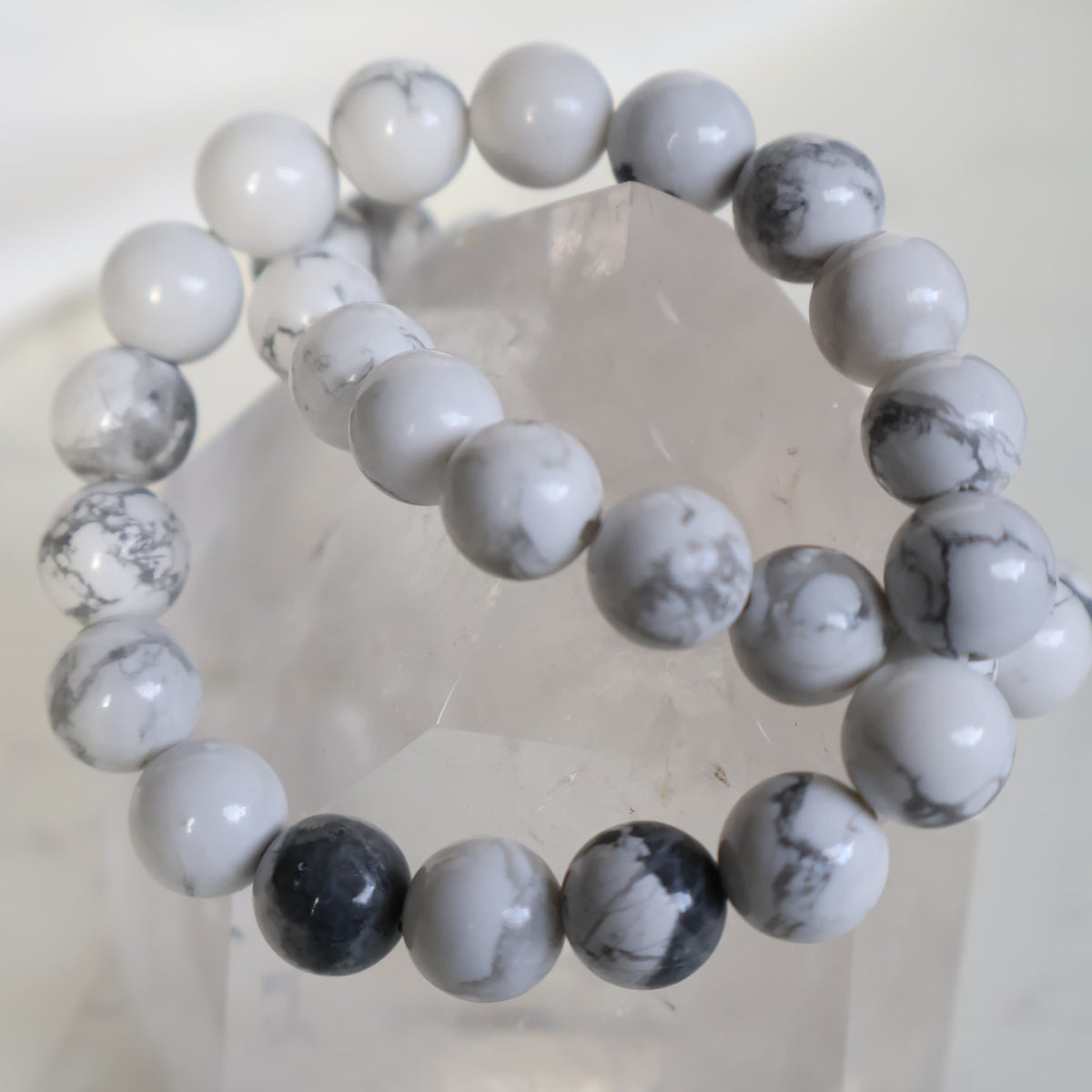 Howlite 10mm bead stretch bracelet with smooth white beads and distinctive natural grey veining.