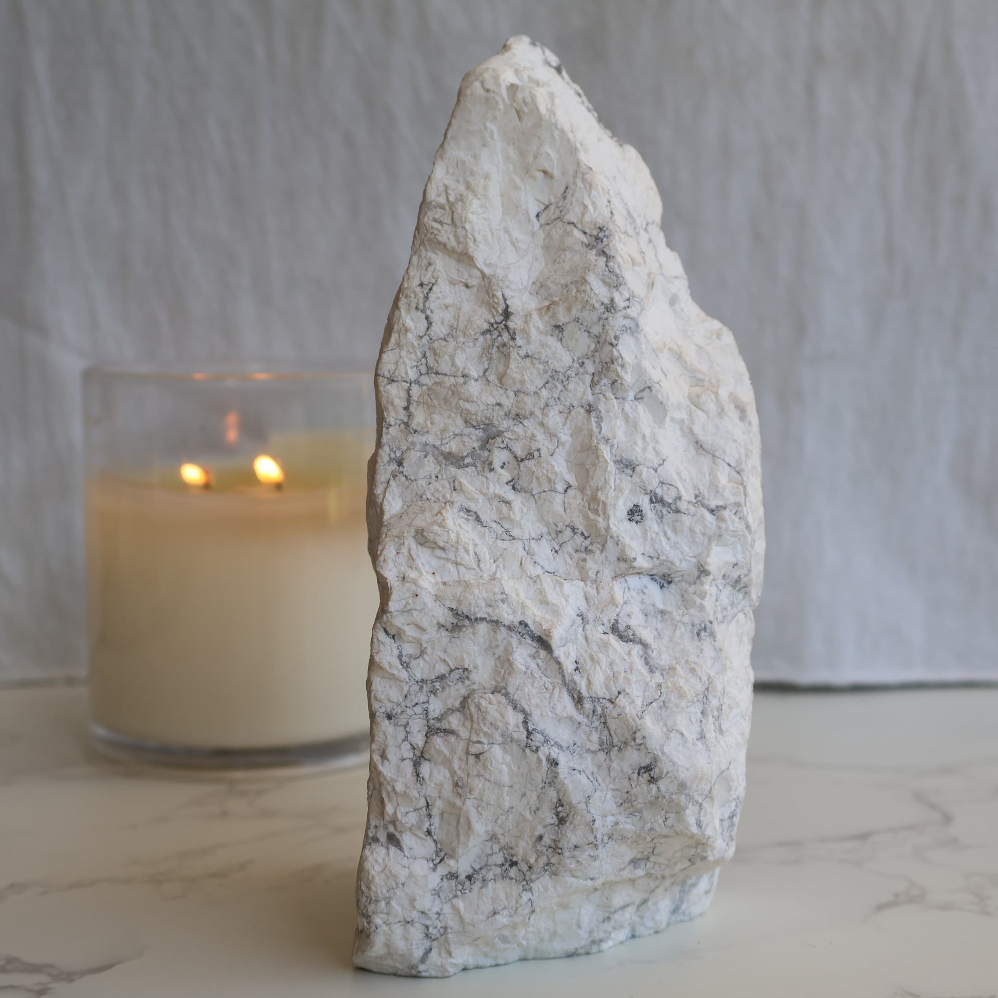 howlite freeform with polished face and natural raw side showing grey veining patterns